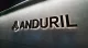 The Anduril logo and name illuminated on an office wall