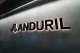 The Anduril logo and name illuminated on an office wall