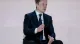 Elon Musk speaking at an event