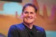 Mark Cuban smiling on stage at an event